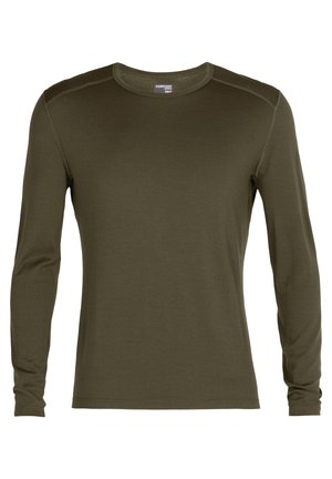Chemise à manches longues de couleur vert foncé, fabriquée en tissu doux. Présente un col rond et une coupe droite avec des détails de coutures subtils.