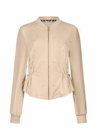 Veste zippée beige avec col aviateur, présentant des côtés froncés, des embellissements subtils et des manches longues. Tissu doux au toucher lisse.