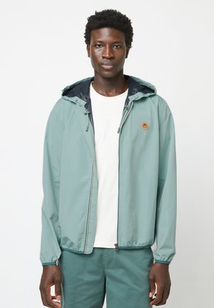 Lichtgewicht, mintgroene zip-up jas met een verstelbare capuchon, elastische manchetten en een logo patch op de borst; soepele textuur en casual pasvorm.