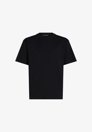 Crna pamučna majica s kratkim rukavima, s reljefnim logotipom "KARL" sprijeda. Okrugli izrez i opušteni kroj.