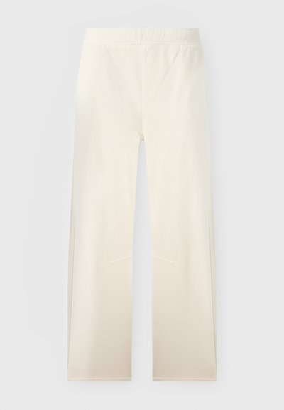 Εκρού παντελόνι με φαρδιά παντελόνα, ελαστική μέση και διακριτικές ραφές μπροστά, παρουσιασμένο σε απλό φόντο.