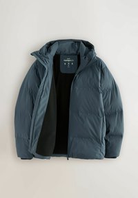 Blue insulated winter jacket with hood, partially unzipped, showing black inner lining and size label "M" on the collar area.