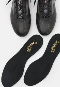 adidas Performance F50 ELITE FIRM GROUND - Fodboldstøvler til fast underlag - core black/iron metallic/gold metallic