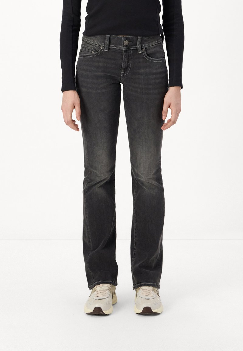 Black denim jeans with a slim fit and slightly flared legs. Features slight fading, classic five-pocket design, and button closure.