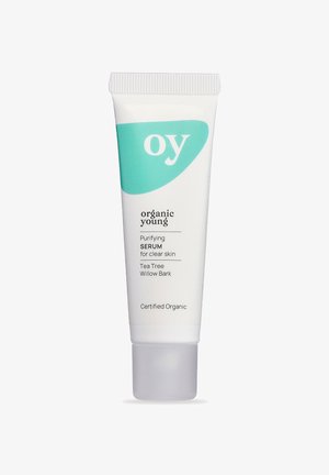 Tube mit reinigendem Serum für klare Haut aus biologischem Anbau, mit Teebaum und Weidenrinde, gekennzeichnet als zertifiziert biologisch.