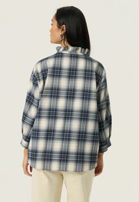 Soaked in Luxury Blouse - navy checks