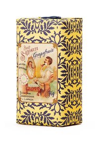 Gelbe Seifenverpackung mit navy-blühendem Muster, ausgestattet mit einem Vintage-Etikett, das einen Mann vor einem Spiegel zeigt, sowie dem Text "Grapefruit".