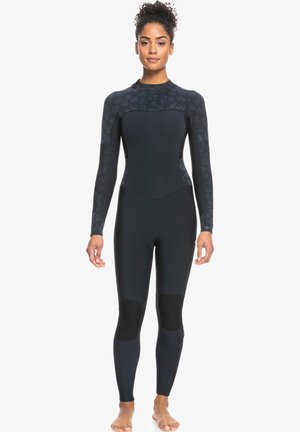 Black wetsuit with long sleeves, featuring textured black-patterned yoke and knee pads, designed for flexibility and thermal insulation.