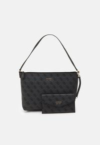 Black Guess handbag and matching wallet. Both feature an embossed pattern, smooth texture, and gold-tone logo accents.