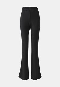 ONLFEVER FLARED PANTS - Tygbyxor - black