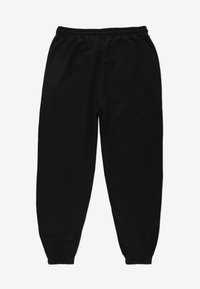 Czarne spodnie dresowe wykonane z miękkiego materiału, z elastycznym pasem i zwężanymi ściągaczami dla wygodnego dopasowania. Bez widocznych wzorów.