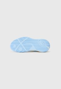 Blue rubber outsole with textured herringbone pattern and circular logo accent. Features reinforced traction grooves for grip and stability.