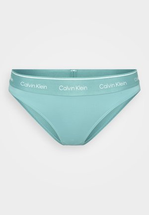 Helltürkise Bikini-Brief mit kontrastierendem Bund und weißem "Calvin Klein"-Branding sowie glattem, dehnbarem Stoff.