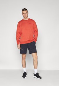 Under Armour ICON FLEECE - Sudadera - earthen orange/light heather