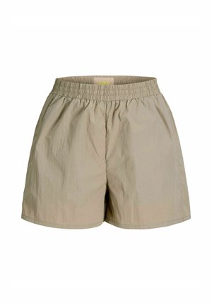 Pantaloncini con vita elastica beige, taglio ampio e tessuto leggero, progettati per un uso casual.