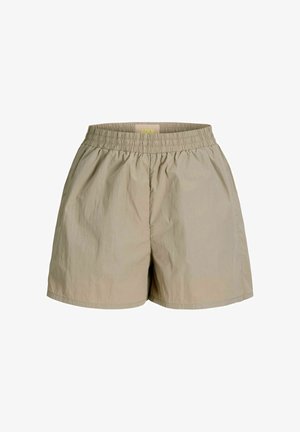 Pantaloncini con vita elastica beige, taglio ampio e tessuto leggero, progettati per un uso casual.