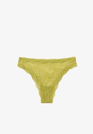 Grüner Spitzen-Tanga mit floralen Mustern, gewellten Kanten und einer durchsichtigen Textur. Leicht und für minimalen Halt designed.