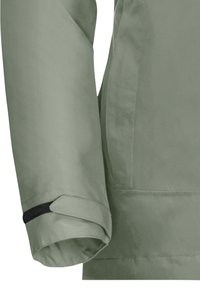 Jasnozielony rękaw kurtki o gładkiej fakturze, z czarnym paskiem do regulacji i mankietem na końcu.