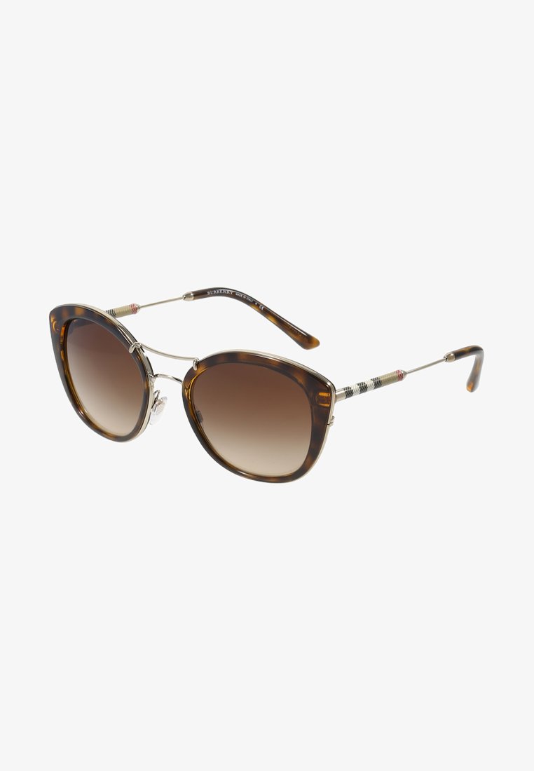 Ochelari de soare tip cat-eye din tortoiseshell cu lentile maronii degradate și accente subțiri din metal auriu. Brațele texturate prezintă detalii colorate.