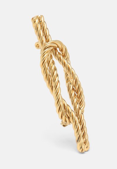 Auksinė susisukta vielos apyrankė su mazguoto dizaino, lygiu paviršiumi ir blizgiu apdaila, pabrėžiančia lyno struktūrą.