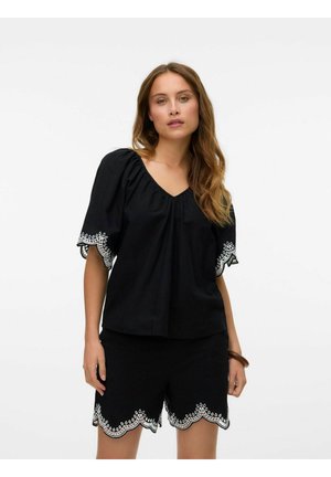 Black short-sleeve top with a V-neck and gathered shoulders, featuring white embroidered accents on sleeves. Paired with matching shorts.