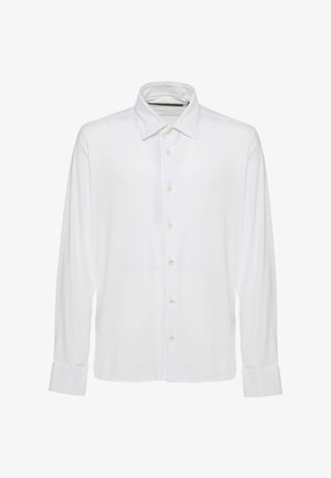 Camicia bianca a maniche lunghe con bottoni, colletto appuntito e polsini, mostrata frontalmente su sfondo bianco uniforme.