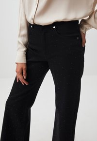 Jimmy Key WIDE LEG SHINY STONES - Jeans a zampa - black