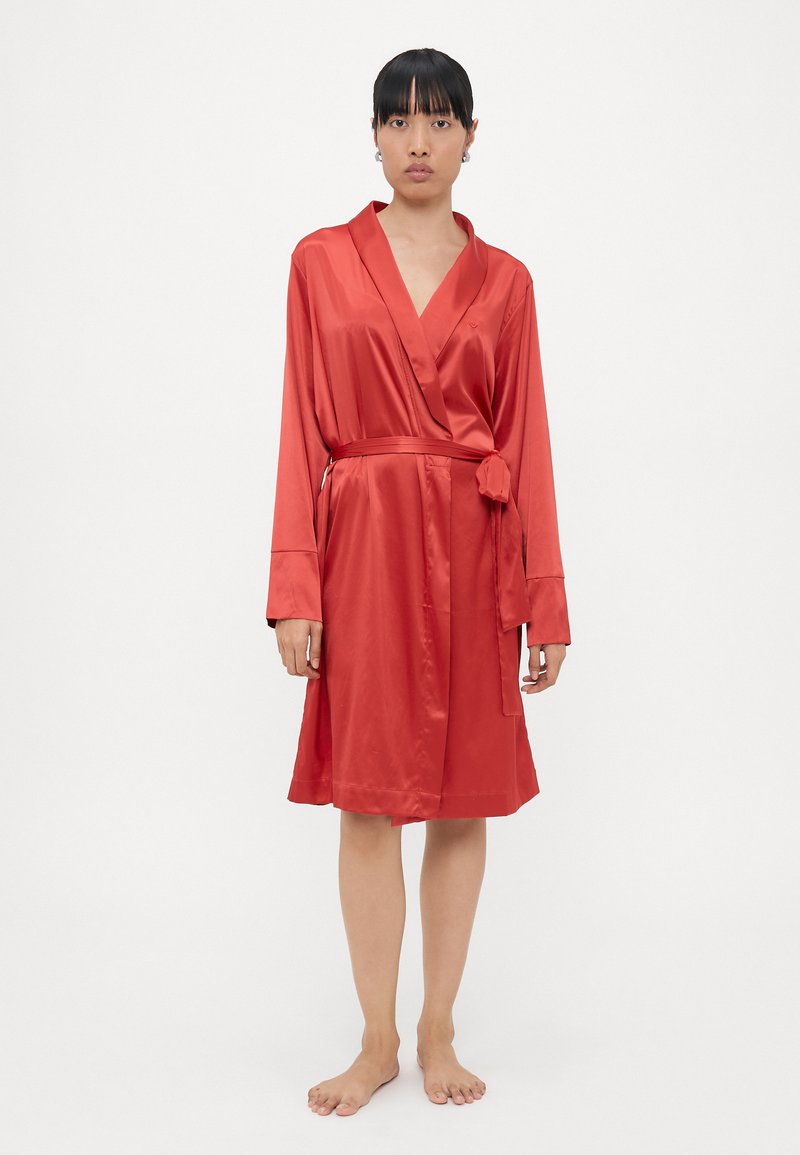 Red satin robe featuring a wrap design, long sleeves, and a tie belt. Smooth texture, knee-length, with a simple collar.