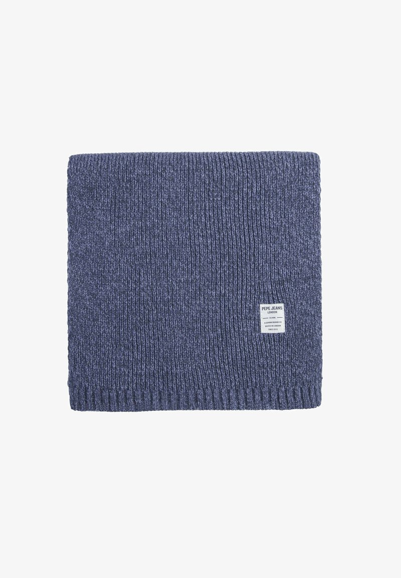 Suéter de punto azul marino con textura acanalada, que presenta una etiqueta en el borde inferior. Forma rectangular, hilo grueso para proporcionar calor.