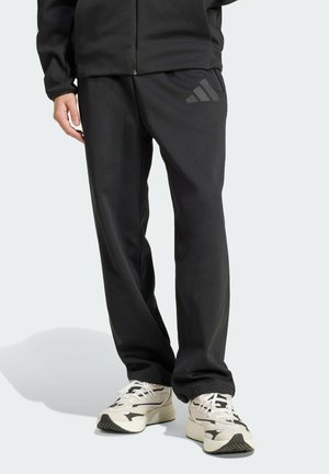 Z N E OPEN-HEM LOOSE - Träningsbyxor - black
