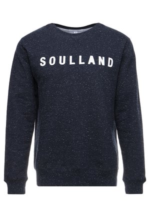 Merinopoloinen collegepaita tummansinisellä speckle-kuviolla, jossa edessä valkoisella printattu "SOULLAND". Resorit hihansuissa ja helmassa, pyöreä pääntie.