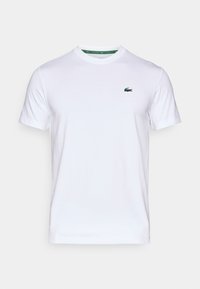 Λευκό κοντομάνικο μπλουζάκι crew neck με μικρό πράσινο λογότυπο κροκοδείλου στην αριστερή πλευρά του στήθους.