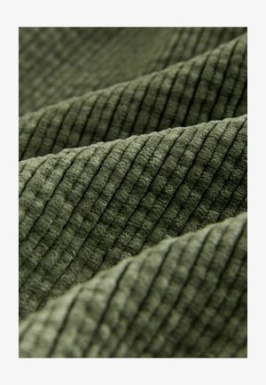 Olive green textured fabric with prominent vertical ribbing; soft texture, visible folds, and subtle sheen enhance depth and dimension.