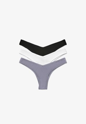 Tre perizoma nei colori nero, bianco e lavanda. Ognuno presenta un sottile elastico in vita e un morbido tessuto di cotone con un design minimalista.