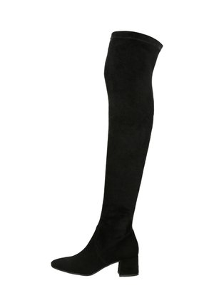 Bottes noires montantes en suède doux. Dotées d'un bout pointu et d'un talon bloc épais. Texture lisse sans embellissements visibles.