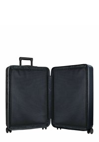 Valise noire avec un extérieur dur, deux roues à roulement fluide, une poignée télescopique et un intérieur spacieux avec des diviseurs en maille.