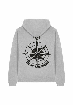 Grijze hoodie met een zwarte kompasafbeelding en de tekst "VOLG JE DROMEN" eronder. Gemaakt van zacht fleece-materiaal met een capuchon.