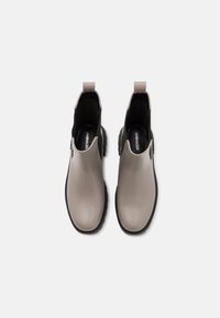 Gray waterproof ankle boots with a smooth finish, rounded toe, and elastic side panels. Features a pull tab for easy wear. Black rubber sole.