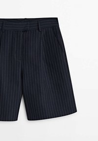Navy blue shorts with a vertical pinstripe pattern, featuring a flat front, belt loops, and side pockets. Made from lightweight fabric.