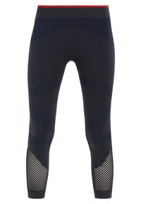 Marina leggings med en texturerad meshpanel vid anklarna, med en kontrasterande röd midja och subtila vågmönster genom hela. 