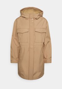 Parka à capuche beige avec boutons-pression à l'avant, deux grandes poches poitrine à rabat, et poches latérales, conçue pour temps froid.