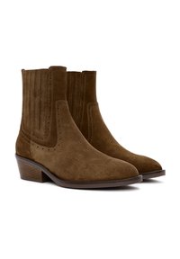 Brown suede ankle boots with a stacked heel, featuring vertical ribbing and perforated accents along the sides. Smooth texture throughout.