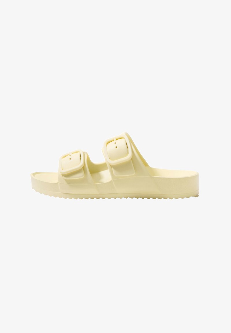 Yellow sandal with two adjustable buckle straps, flat sole, textured footbed, and a ridged outsole for grip. Made from lightweight plastic material.