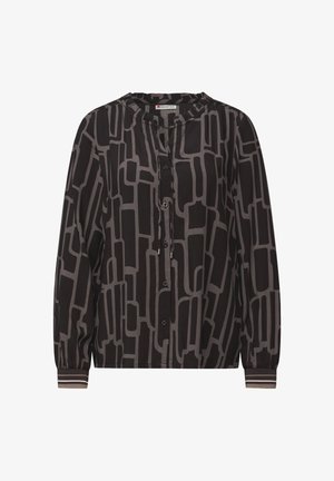 Blus med lång ärm i svart tyg med ett geometriskt ljusgrått mönster. Har knäppt framstycke, veckad halsringning och randiga muddar.