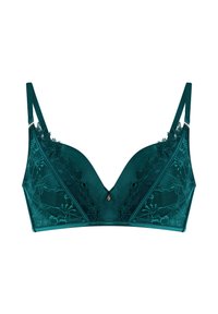 Smaragdgrøn bh med en glat satinlignende base og intrikat blondeoverlay, v-formet design, justerbare stropper og centralt dekorativt element.