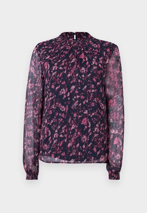 Kerge tumesinine pluus, millel on lilleline roosa print, kõrge kaelus, pikad läbipaistvad varrukad elastsete mansettidega ning nööbikinnitus seljal.