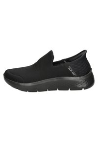 Sneaker neri senza lacci realizzati in mesh, con una tomaia testurizzata, suola ammortizzata e un design liscio e elegante.