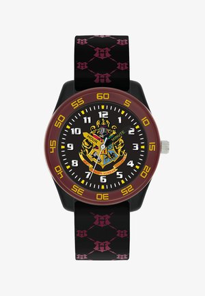 Runde Uhr mit schwarzem Zifferblatt, gelben Stundenmarkierungen und einem kastanienbraunen Bezels. Das schwarze Armband hat ein pinkfarbenes Muster. In der Mitte befindet sich ein Wappen-Design.