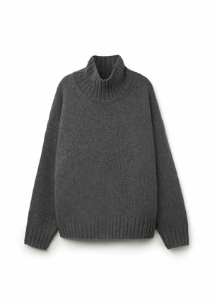 Grå chunky stickad polotröja med ribbade muddar och fåll. Överdimensionerad design med en texturerad yta som ger ett mysigt intryck.