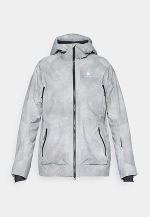 Giacca grigia chiara con cappuccio, caratterizzata da una finitura testurizzata, cerniere nere e due tasche laterali. Logo sul lato sinistro superiore.